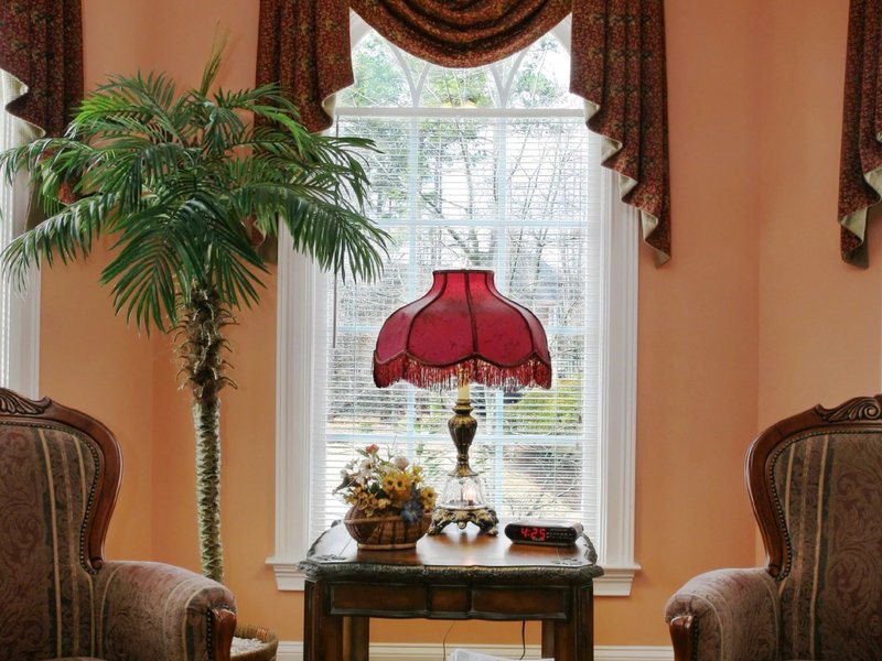 Living room with wood floor two armchairs and side table
