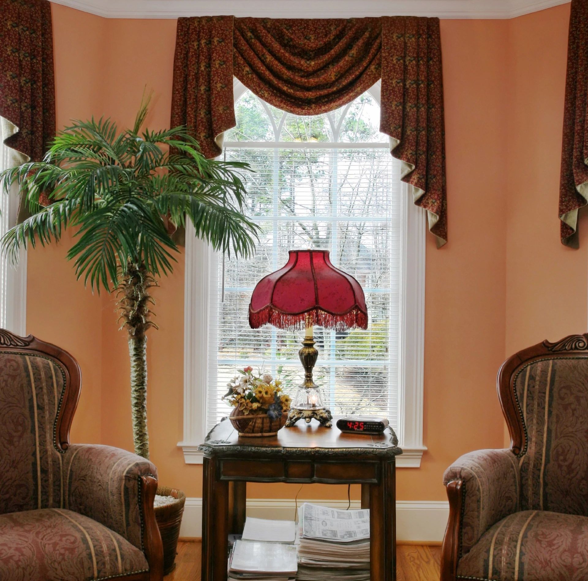 Living room with wood floor two armchairs and side table