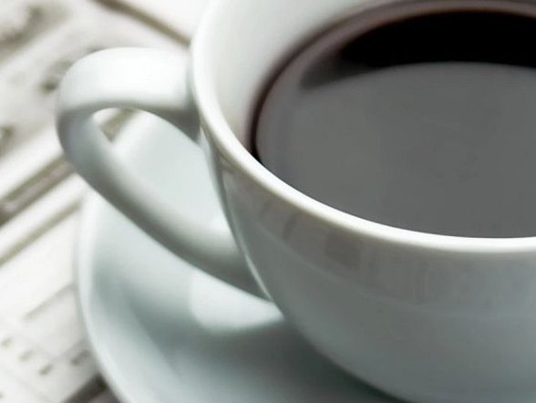 cup of coffee on table from Solutions in West Fargo