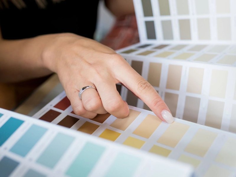 people choosing from color swatches from Solutions in West Fargo